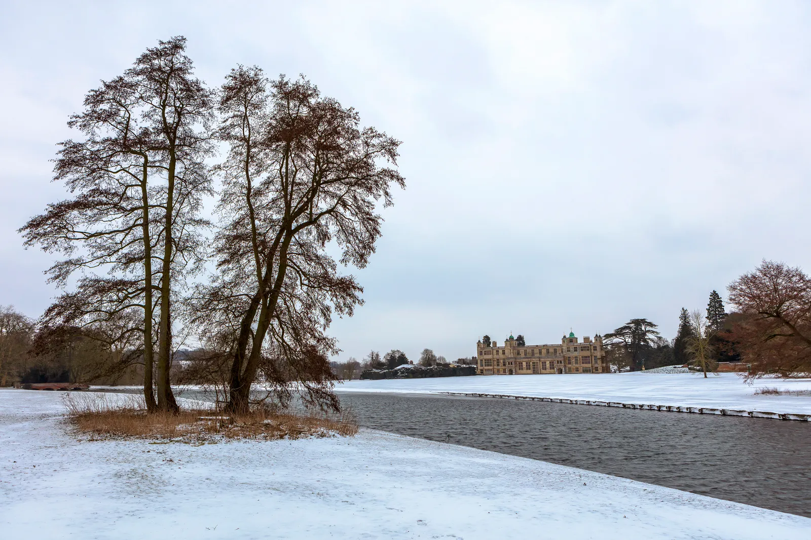 The house across the lake in snow