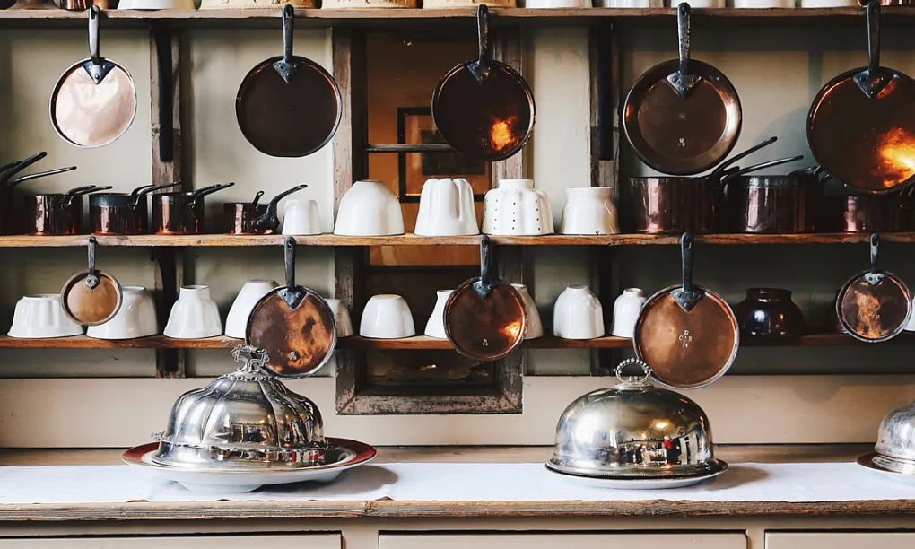 Copper pans and moulds on the dresser in the Victorian kitchen