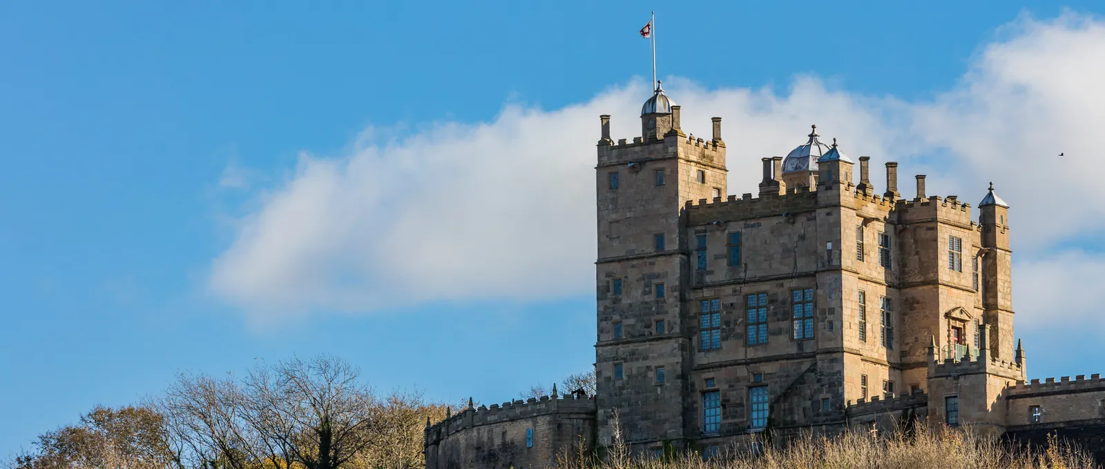The Little Castle's turrets and domes against a blue sky