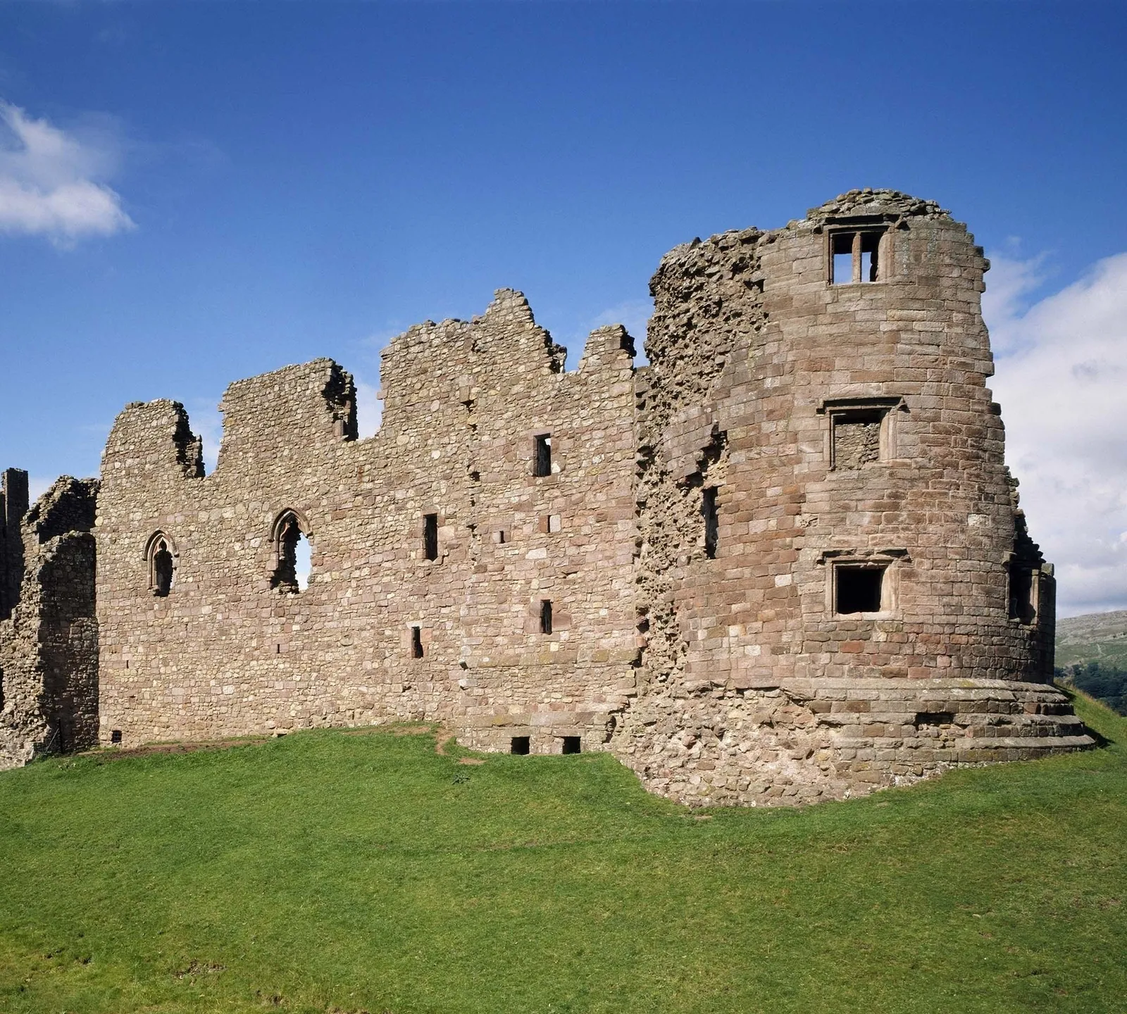 Clifford's Tower, the round corner tower of Brough Castle, under a blue sky