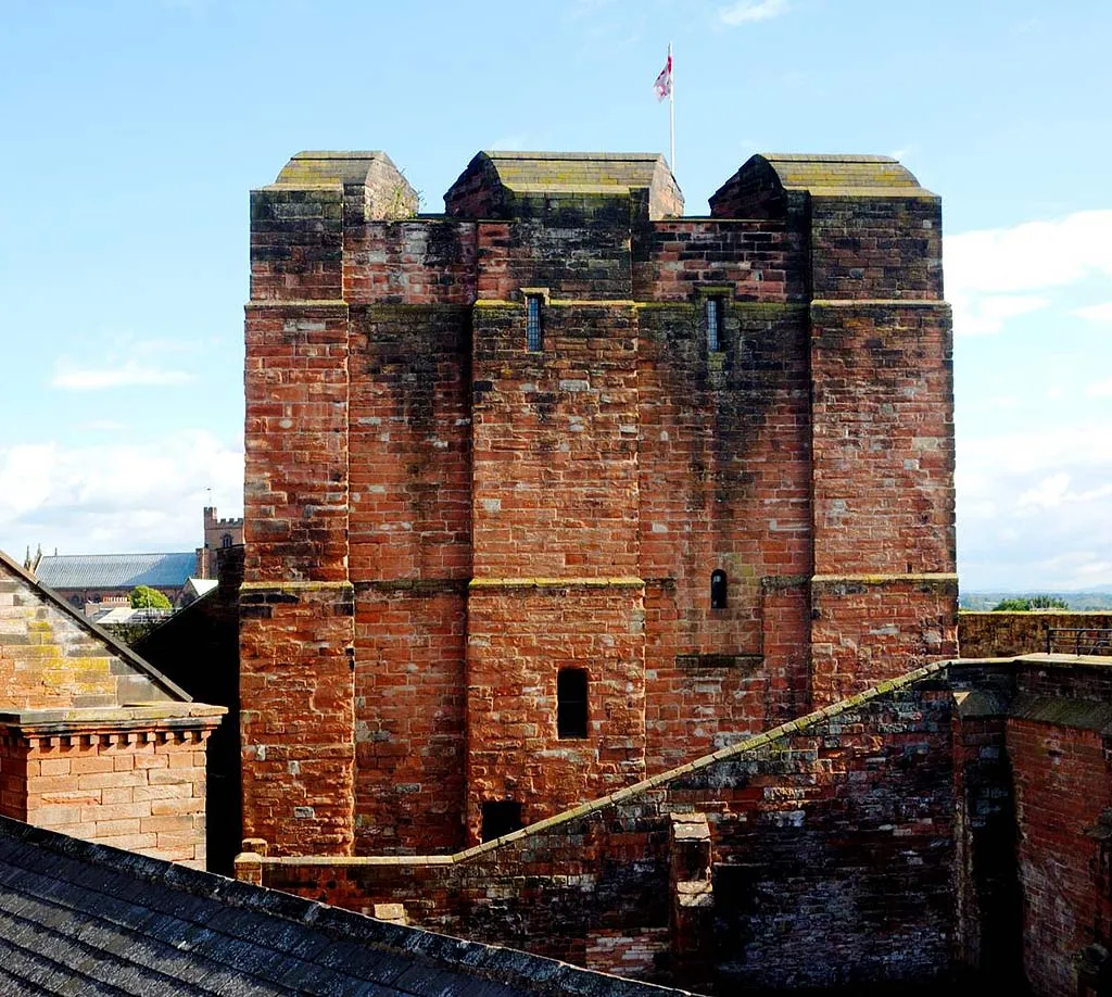 The red sandstone keep rising above the castle rooftops
