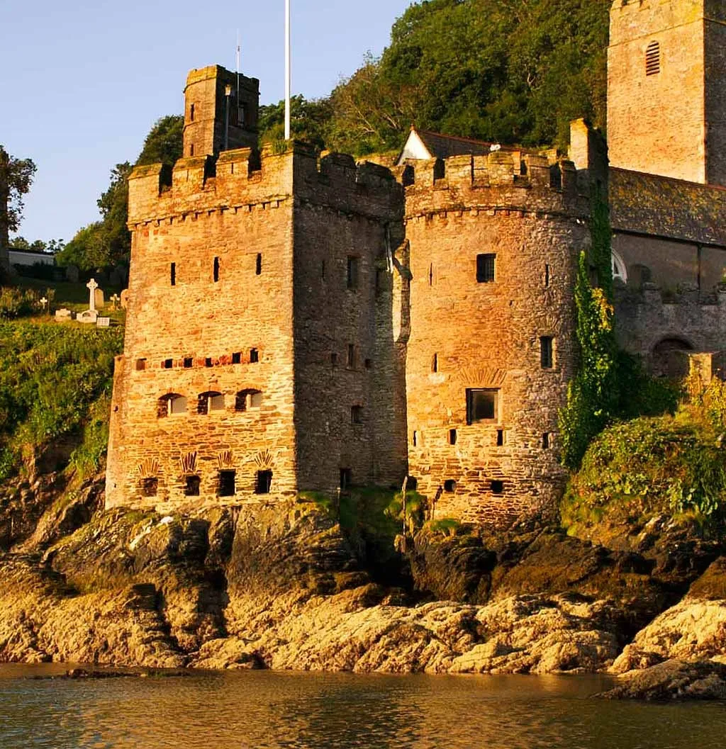 The gun tower glowing in evening sun above the rocks