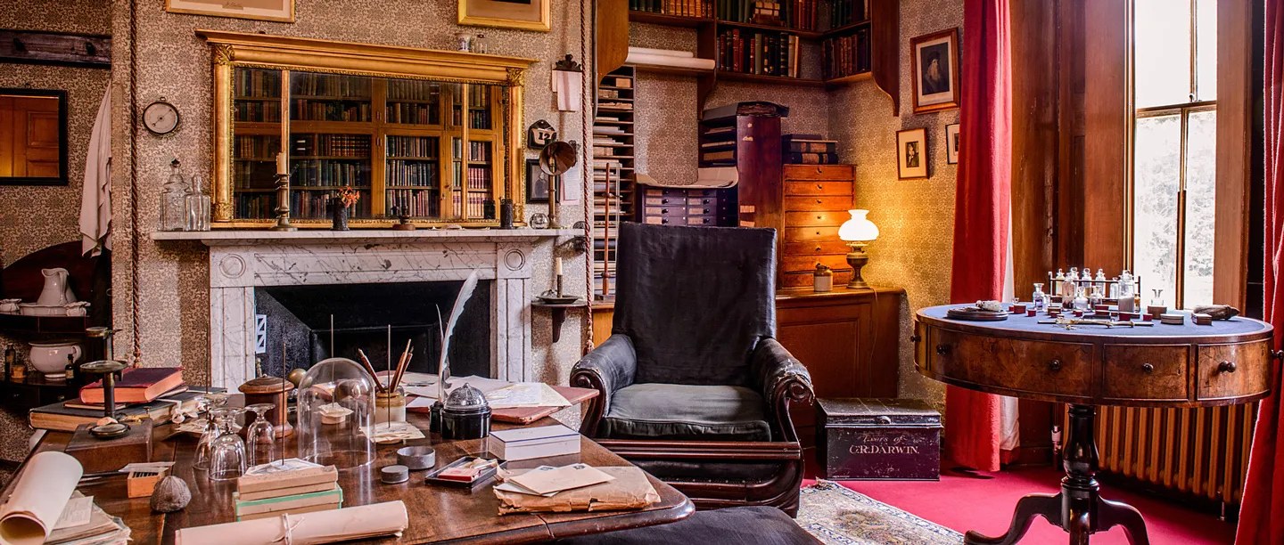 Darwin's study, with his desk of specimens and instruments before the marble fireplace