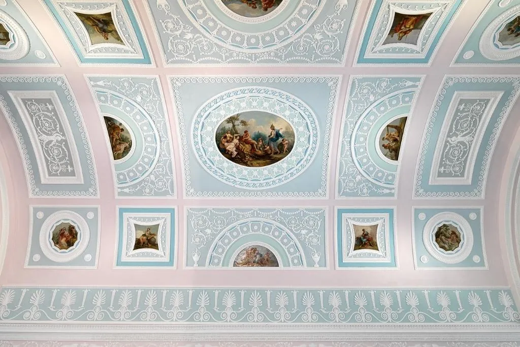 The painted and moulded ceiling of the library