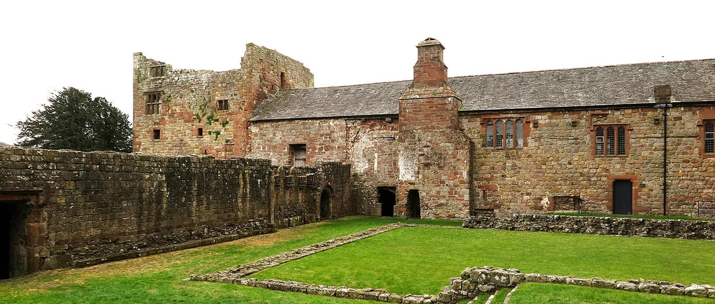 The Dacre Hall range and old tower beyond the cloister wall