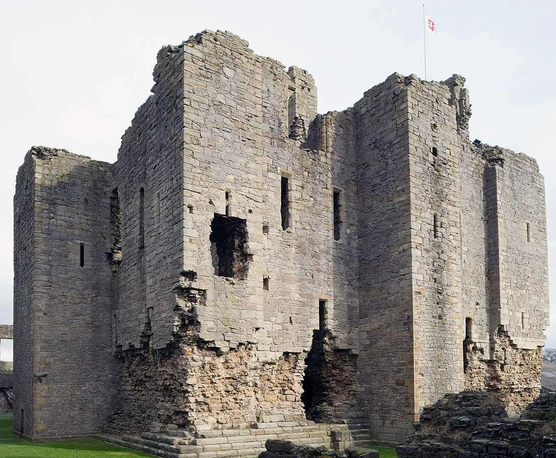 The great keep's tall corner towers, built of grey stone