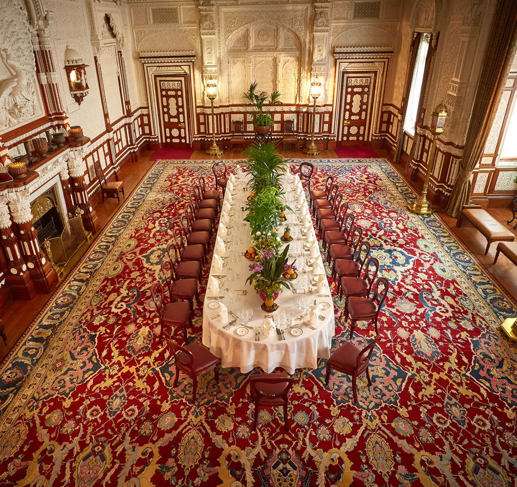The Durbar Room laid for a banquet beneath its Indian plasterwork