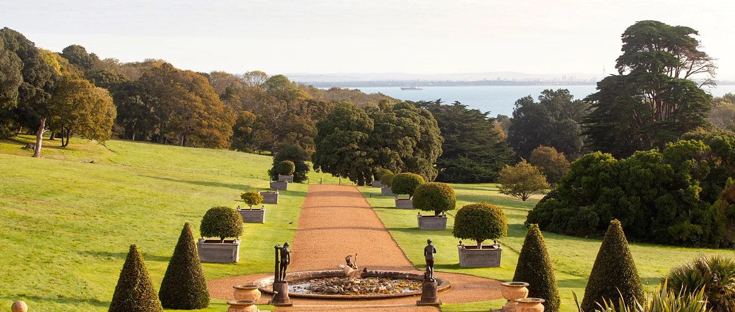 The avenue of clipped trees running down towards the Solent in autumn
