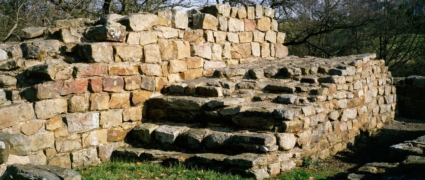 The stone stairway that once led up to the wall walk at Poltross Burn milecastle, built of square sandstone blocks
