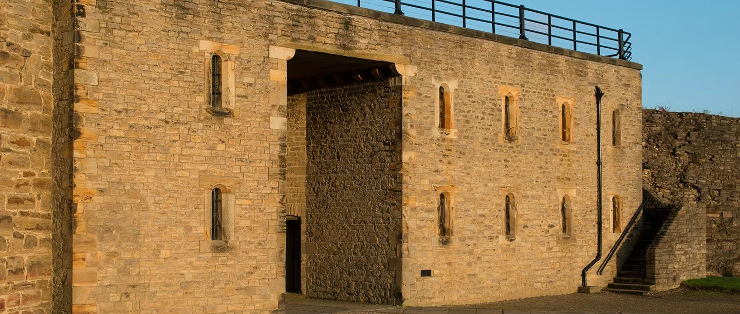 The 19th-century cell block in evening sun