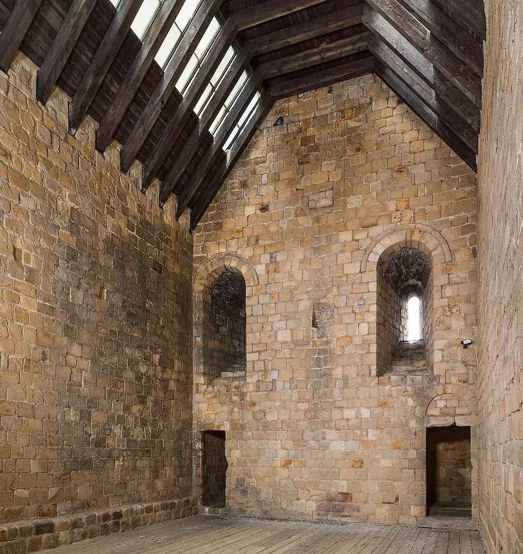 The keep's great hall with its timber roof and deep window embrasure