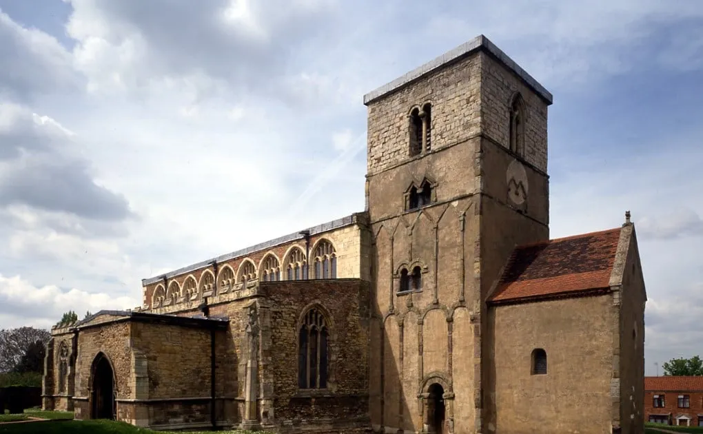 The Anglo-Saxon tower and small baptistery of St Peter's Church, Barton-upon-Humber, beside the later Gothic nave
