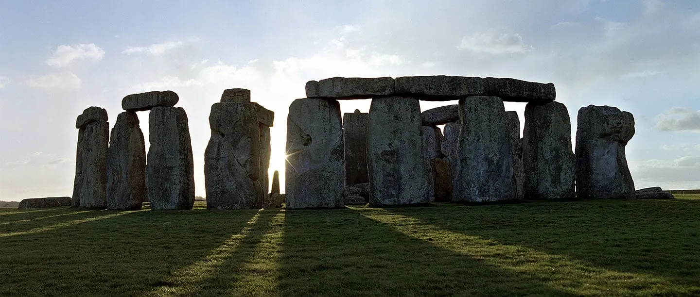 The stones from the north-east, with long shadows across the grass