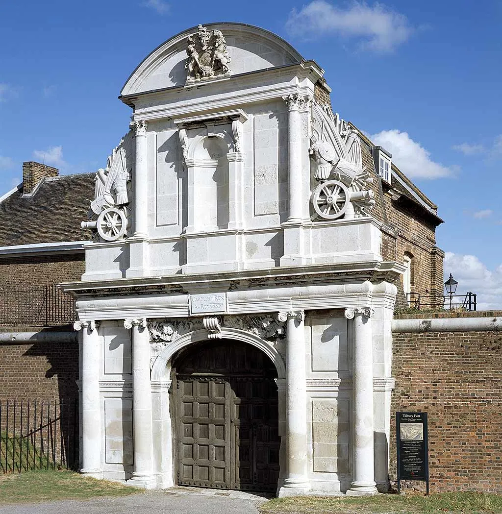 The carved stone Water Gate with the royal arms and trophies of arms above the oak doors