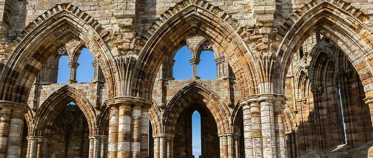 The pointed arches and banded columns of the choir