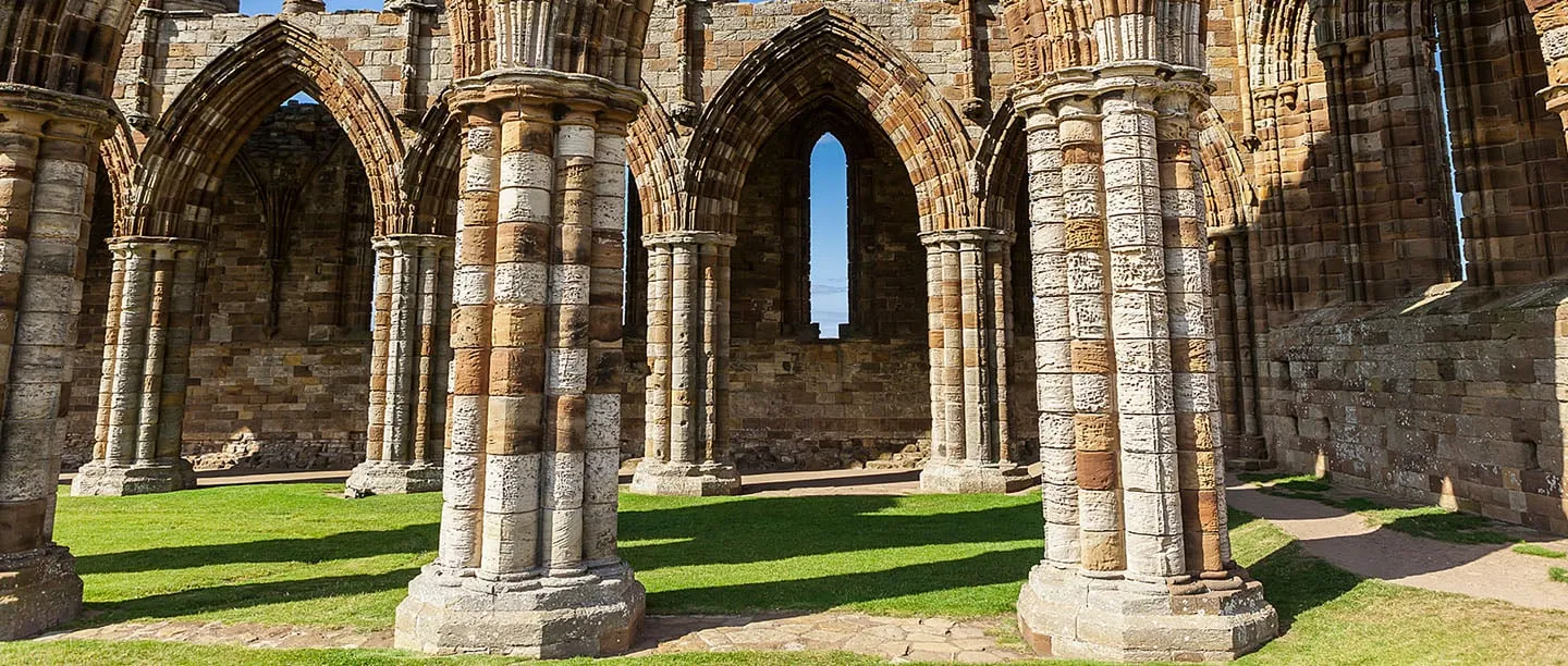 Banded stone columns of the abbey church in sunshine