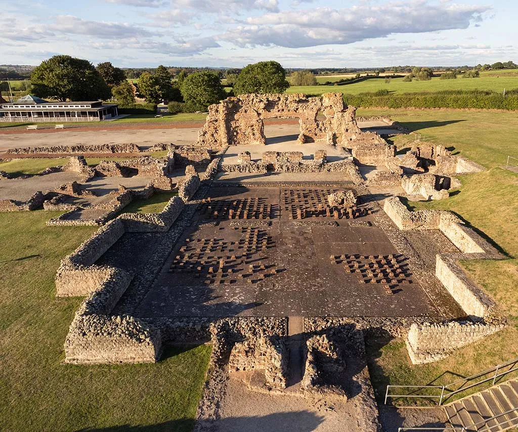 The excavated bath house of Wroxeter from above, with rows of hypocaust pillars and the Old Work