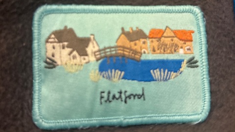 Embroidered badge at Flatford